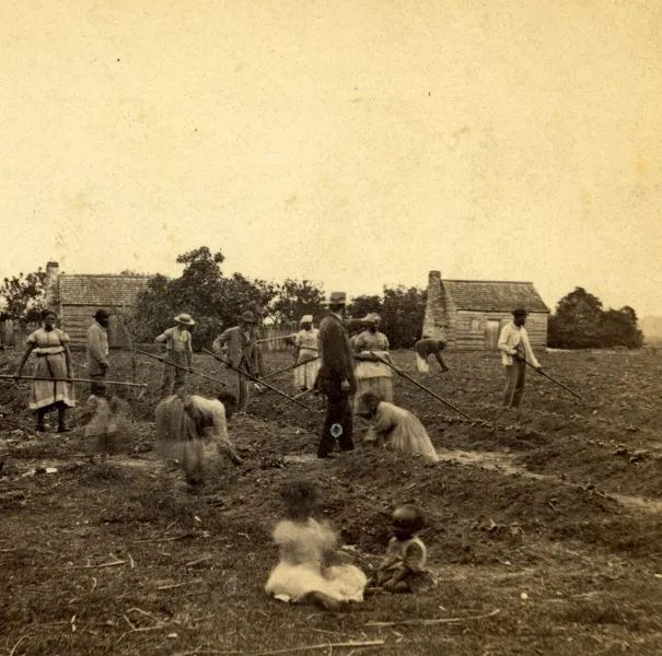 Plantation superintendent standing amidst enslaved persons on St. Helena Island, South Carolina